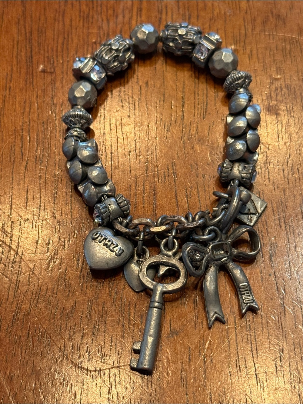 Vintage charm bracelet by Rodrigo Otazu. Known for bold statement jewelry